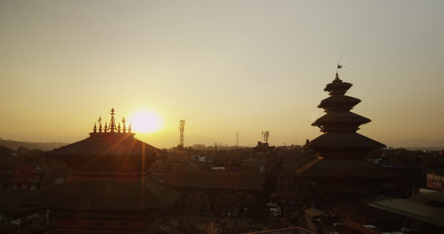 Time lapse of a sunset at Nyatapola Temple and Bhairavnath temple in Bhaktapur, Nepal. The Himalayan Mountain Range can be seen in the distance. Shot on Red Scarlet.