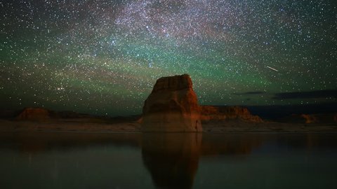 4K Astrophotography time lapse footage with zoom out motion of star trails over lone rock in Lake Powell, Glen Canyon National Recreation Area, Utah
