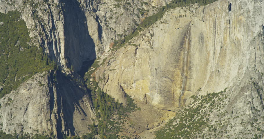 Yosemite Falls can be seen from Glacier Viewpoint during noon. Yosemite National Park, California is visited by over 3.7 million tourists yearly. Shot on Red Epic.