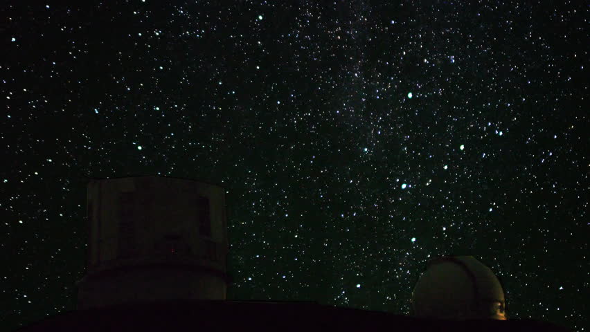 4K Astrophotography time lapse with tilt up motion of stars over Mauna Kea Observatories in Hawaii