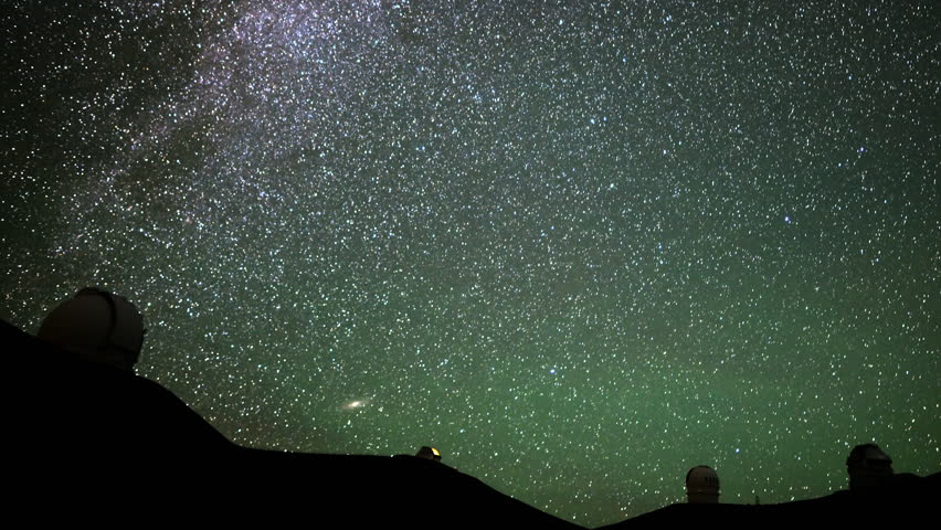 4K Astrophotography time lapse with pan right motion of stars over Mauna Kea Observatories in Hawaii
