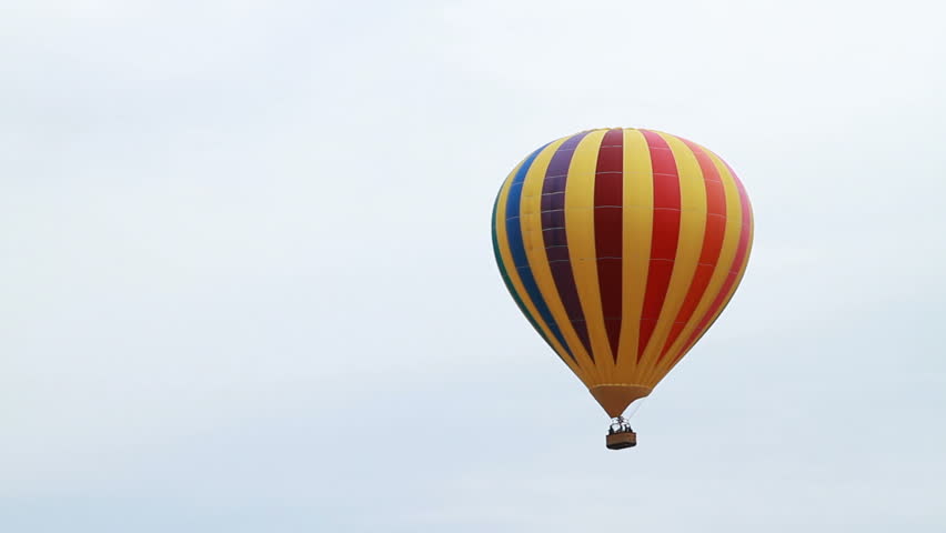 A hot air balloon flying through air.