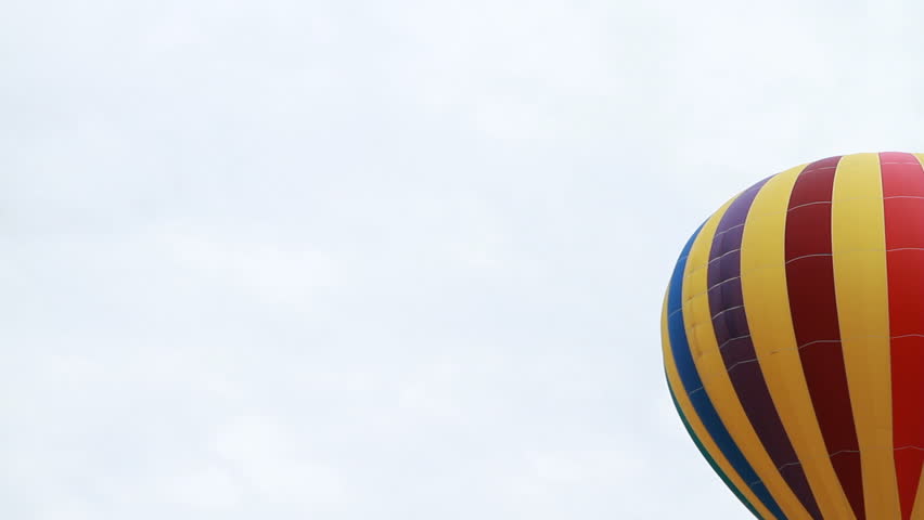 A hot air balloon flying through air.