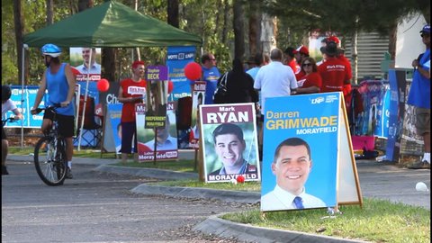 MORAYFIELD, AUSTRALIA - JANUARY 31: Queensland State Election undentified party volunteers haning out how to vote cards on January 31, 2015 in Morayfield, Australia
