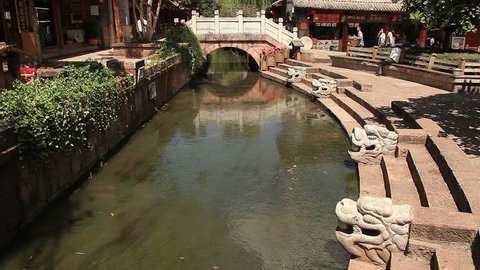 LIJIANG, CHINA - SEPTEMBER, 2014: ancient bridge in Dayan old town, Lijiang, China on September, 2014. Lijiang is one of the most beautiful cities of China with a rich culture and history.