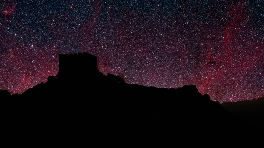 Old world stars. Dramatic time lapse view of stars moving over a old castle ruins.