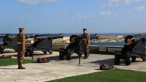 VALETTA, MALTA - JANUARY 21 2015: Gunfire at mid-day from Saluting Battery one of Malta's most vibrant visitor attractions. It is the oldest saluting battery still in operation anywhere in the world.