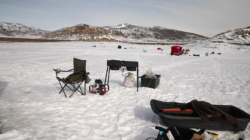 Cooking breakfast and ice fishing on a frozen lake in a tent.  (Strawberry Reservoir, Utah)