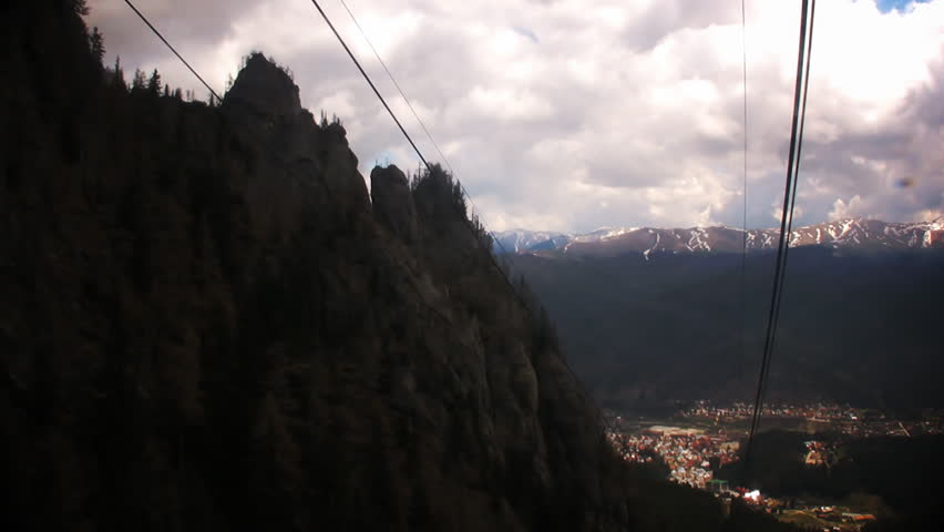 Cable car climbing on mountain