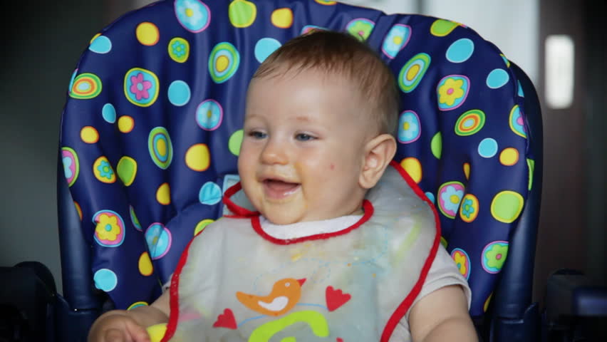 Baby boy at lunch time laughing, sound included