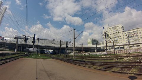 Timelapse of the Basarab bridge over the Bucharest central train station, with trains and clouds.