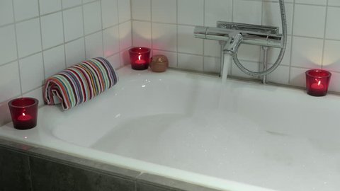Tapping up a bath, with candles (2 of 4)