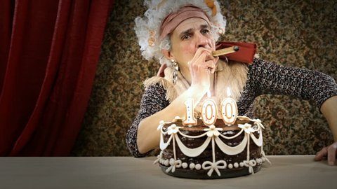 Funny senior woman is celebrating her birtHDay smoking a cigar - HD video footage