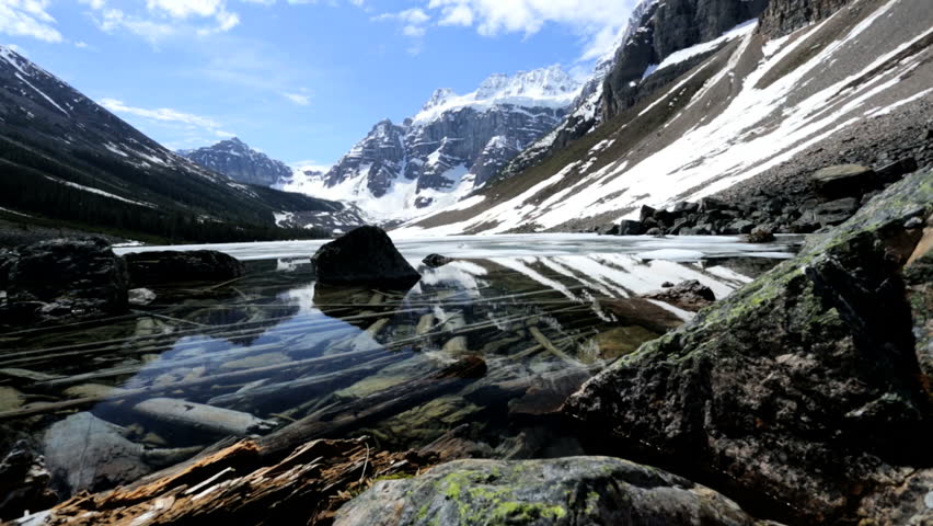 Lake Moraine British Columbia glacial water reflections remote environmental rugged landscape travel location extreme terrain