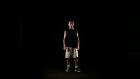 Young athletic sportsman perform basketball freestyle trick - HD video footage