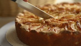 Cutting an italian apple pie for breakfast - HD video footage