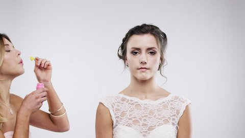 bridesmaid blowing bubbles slow motion wedding photo booth series