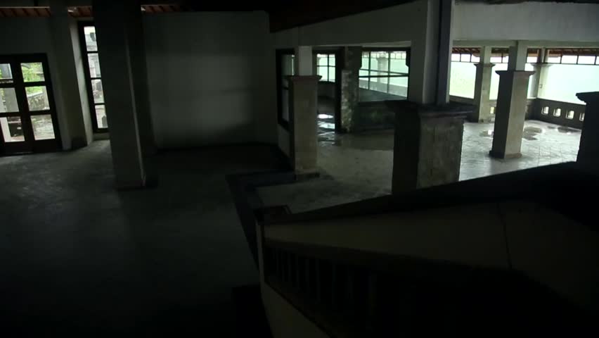 young girl walking on an abandoned hotel