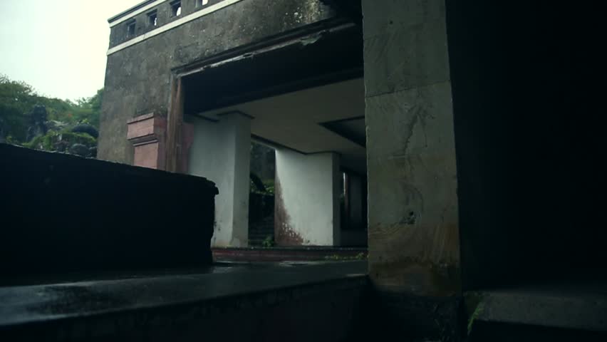 young girl walking on an abandoned hotel
