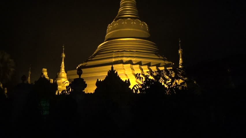 golden asia buddhists stupa temple in Kushinagar at night, India