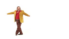 Middle-age man dressing 70s brown-red vintage clothes makes dance move on 103 bpm music track - isolated-on-white HD video footage