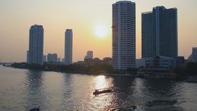 Time Lapse,Bangkok city  a passenger boat in the river with sunset