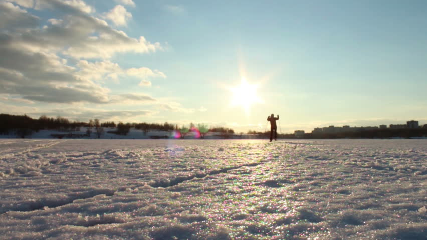Cross-country skiing on a flat surface of a pond on a warm day. Athlete slow motion towards the camera in the sun
Athlete slow motion towards the camera against the sun Royalty-Free Stock Footage #8740747