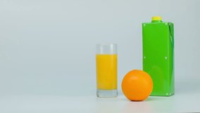 pack shot, pack of orange juice, orange juice in a glass, template for video advertising juice