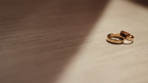 wedding rings on the floor - dolly shot