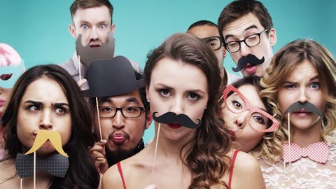 Multi racial group of funny people celebrating slow motion party photo booth Red Epic Dragon