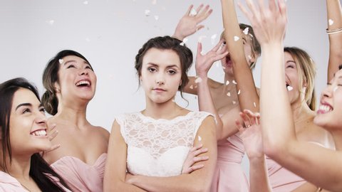 Beautiful bridesmaids throwing confetti slow motion wedding photo booth series