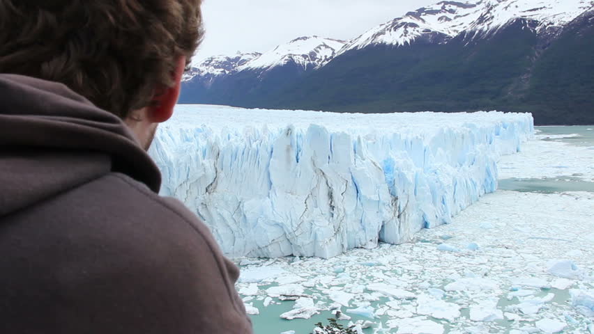 Man Looking At Glacier