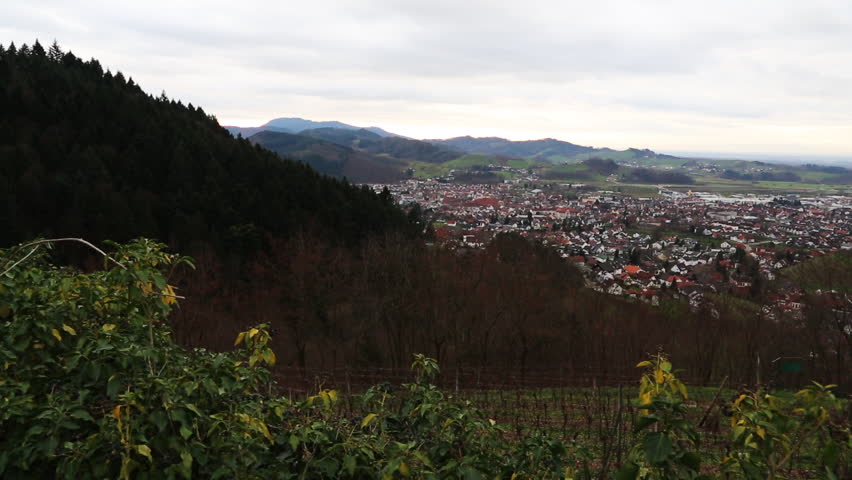 Wide aerial pan view, Black Forest Hills and the town of Oberkirch, Germany. 1080p HD.
