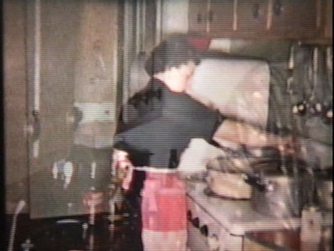 Two women work hard to prepare a lovely Turkey dinner for the big Christmas meal in 1958. Stock Video