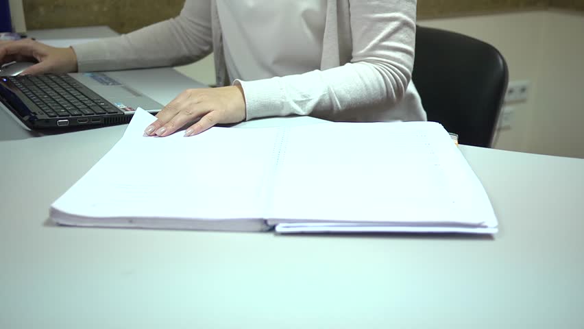 Typing laptop computer in ofice