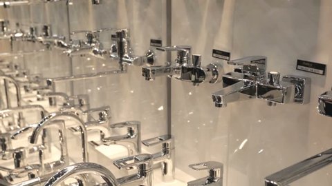 MOSCOW, RUSSIA - FEBRUARY 3, 2015: Faucets stand at Aqua therm Moscow exhibition.  Exibition presents spheres of heating, water supply, sanitary, ventilation, equipment for pools, saunas and spa etc.