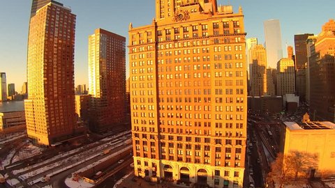 Low aerial view of the financial district, sunset with snow, looking Northwes, uptownt. Very Low aerials of Battery Park, in New York City.