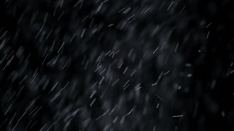Snow falling background. Background of snow fall blowing fast in night winter blizzard. 4K UHD 2160p footage.