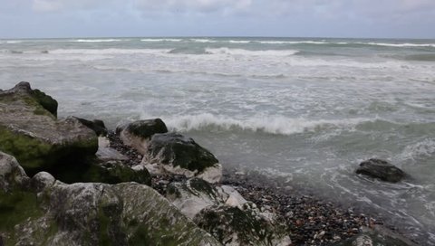 ocean waves crash onto shore