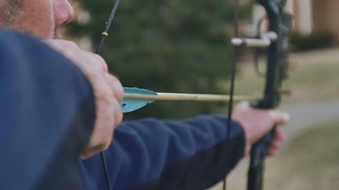 Shooting an arrow, archery in slow motion