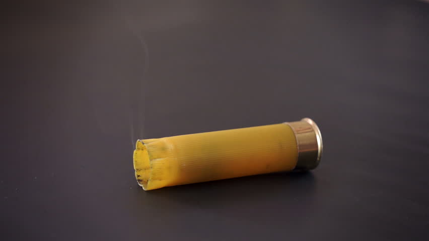 Video Stok spent yellow shotgun shell falls smokes (100% Tanpa Royalti) 879...
