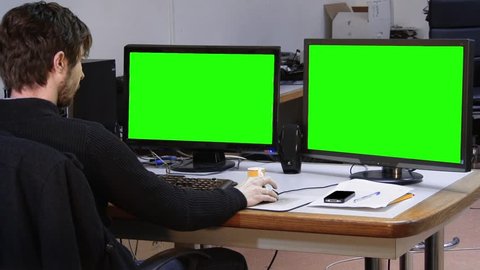 Office guy stretching drink coffee green screen monitors - 1080p
A man in front a green screen office stretching and drinking coffee - Full HD