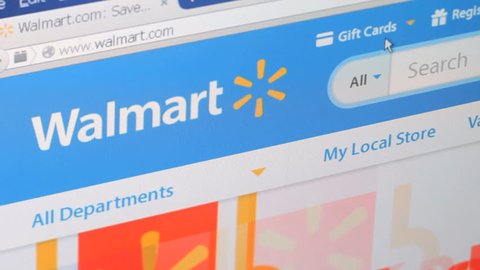 NEW YORK - FEB 11: Shopping online on Walmart website on February 11, 2015. Walmart is the world's largest company by revenue.