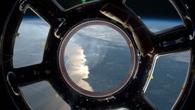 Earth as seen through window of International Space Station (ISS). Perfect of computer graphics videos about: space, earth, orbit, ISS, the International Space Station, astronauts, NASA and discovery
