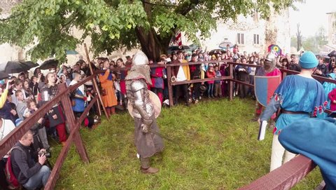 MUKACHEVO, UKRAINE - CIRCA MAY 2014 Chynadiyevo castle near Mukachevo, traditionally held an international festival of medieval culture. Knights sword fight in pen
