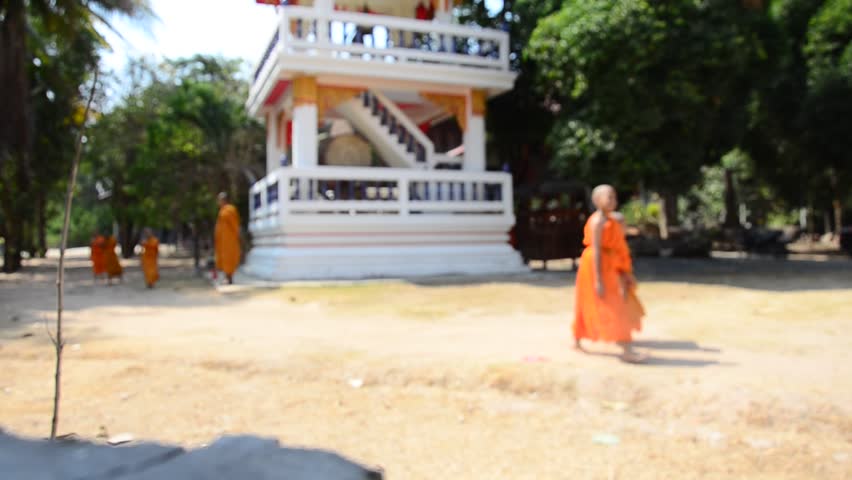 SURIN, THAILAND - FEBRUARY 8 : Buddhist monks and Samanen or a novice monk in a Buddhist context walking at Wat Pho Sri Sa-at of Pon ngoy Village on February 8, 2015 in Surin Thailand.