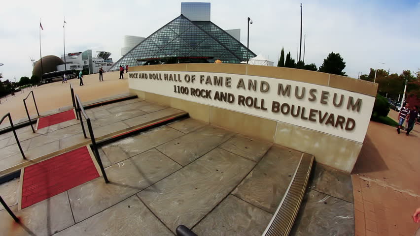 A tourist visits the Rock and Roll Hall of Fame on the shore of Lake Erie in