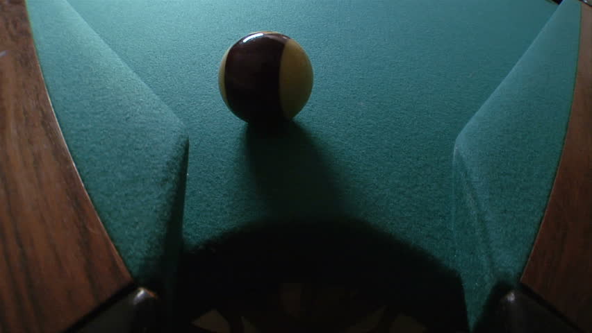 Pool ball goes into corner pocket