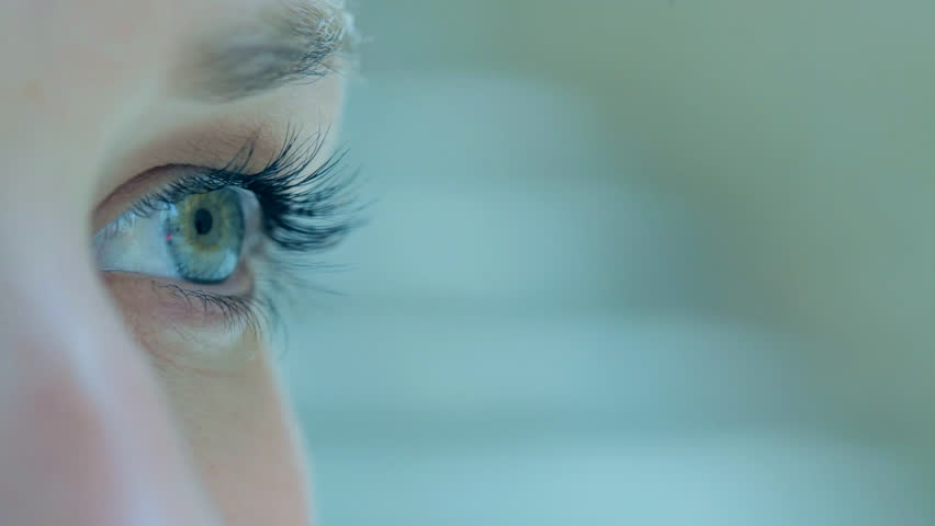 Close up detail view of a young caucasian woman eye looking at the camera and blinking slowly. Eyes and vision well being and healthy eye sight. Attractive woman with blue green eyes. | Shutterstock HD Video #8839039
