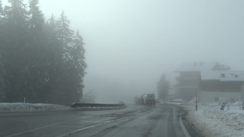 Heavy fog on a country road	, car point of view